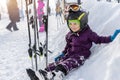 Cute adorable little kid boy enjoy having fun sledging down hill of snow heap snowdrift at alpine mountain skiing resort Royalty Free Stock Photo