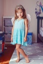 Cute adorable pretty dressed preschool girl playing fairy princess at home. Child creativity imagination and fantasy dreams Royalty Free Stock Photo