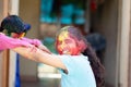 Cute adorable siblings playing with colours during holi festival of colors Indian asian caucasian creative portrait