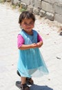 Cute Afghan girl smiling and posing to camera