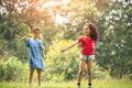 Cute african american and Asian little girl playing outdoor.  Friends happy playing with bubbles together Royalty Free Stock Photo