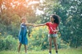 Cute african american and Asian little girl playing outdoor.  Friends happy playing with bubbles together Royalty Free Stock Photo