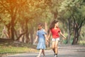 Cute african american and Asian little girl playing outdoor. Two little girl walking in the park Royalty Free Stock Photo