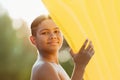 cute african american boy holding inflatable mattress and smiling Royalty Free Stock Photo