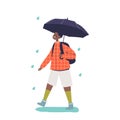 Cute african american boy walking under umbrella in rainy weather Royalty Free Stock Photo