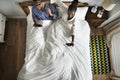 Cute African American couple on bed playing video games Royalty Free Stock Photo