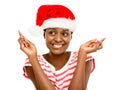 Cute African American girl fingers crossed wearing Christmas hat
