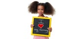 Cute african american girl holding a sign with the phrase I love my mommy Royalty Free Stock Photo