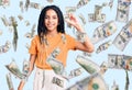 Cute african american girl wearing casual clothes smiling and confident gesturing with hand doing small size sign with fingers Royalty Free Stock Photo