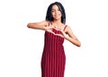 Cute african american girl wearing casual clothes smiling in love showing heart symbol and shape with hands Royalty Free Stock Photo