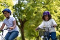 Cute african american kids riding bikes in the park Royalty Free Stock Photo