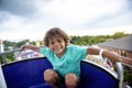 A cute African American little boy enjoying a Ferris Wheel ride at a local carnival Royalty Free Stock Photo
