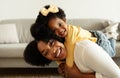 Cute african american little girl toddler hugging her mom Royalty Free Stock Photo