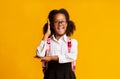 Cute African American Schoolgirl Raising Hand Knowing Answer, Studio Shot Royalty Free Stock Photo