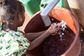 Cute African Ethnicity Offspring Transporting nutritious Water for an insufficiency concept Royalty Free Stock Photo