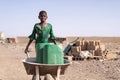 Cute African Girl Carrying Fresh Water in Bamako