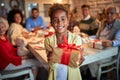 Cute African girl giving Christmas present Royalty Free Stock Photo