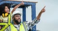 Cute African little child girl role playing engineer wear headphones standing on forklift and foreman father wear safety hat Royalty Free Stock Photo