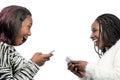 Cute african teen girls laughing with smart phones. Royalty Free Stock Photo