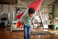 Cute afro american boy playing with paper rocket Royalty Free Stock Photo