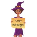 Cute afro-american witch holding a piece of paper with happy halloween text. Royalty Free Stock Photo