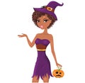 Cute afro-american witch with a pumpkin holding a piece of paper.