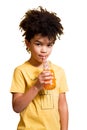 Cute little boy drinking orange juice with a straw Royalty Free Stock Photo