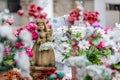 Cute angel girl statue and flowers