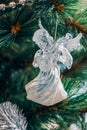 Cute angel is a glass toy hanging and decorating the Christmas tree Royalty Free Stock Photo