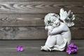 Angel guardian sleeping on wooden background Royalty Free Stock Photo