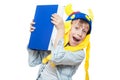 Cute angry stylish child wearing funny hat holding a very big blue book Royalty Free Stock Photo