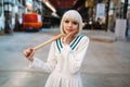 Cute anime style blonde girl with baseball bat