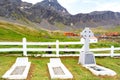 Cemetery of Grytviken, South Georgia, with Graves and Celtic Cross. Curious Antarctic Fur Seals. Old Whale Station Behind Fence