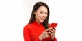 Cute asia girl in ao dai smiling and connect internet shopping online and present Royalty Free Stock Photo