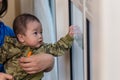 Cute Asian Baby boy with camouflage jacket Royalty Free Stock Photo