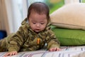 Cute Asian Baby boy with camouflage jacket Royalty Free Stock Photo