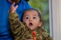 Cute Asian Baby boy with camouflage jacket Royalty Free Stock Photo