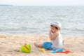 Cute Asian baby boy playing with beach toys on tropical beach and sea Royalty Free Stock Photo