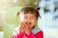 Cute asian baby girl laughing and playing peekaboo or hide and seek Royalty Free Stock Photo