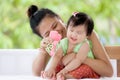 Cute asian baby girl smiling and playing with her mother Royalty Free Stock Photo