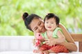 Cute asian baby girl smiling and playing with her mother Royalty Free Stock Photo