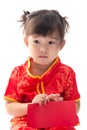 Cute Asian baby girl in traditional Chinese suit with red pocket Royalty Free Stock Photo