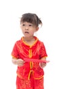 Cute Asian baby girl in traditional Chinese suit with red pocket Royalty Free Stock Photo