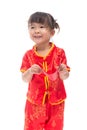 Cute Asian baby girl in traditional Chinese suit with red pocket Royalty Free Stock Photo