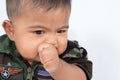 Cute asian baby sucking thumb Royalty Free Stock Photo