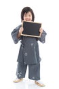 Cute asian boy holding black board on white background Royalty Free Stock Photo