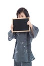 Cute asian boy holding black board on white background Royalty Free Stock Photo