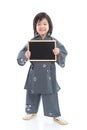 Cute asian boy holding black board on white background Royalty Free Stock Photo