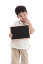 Cute asian boy holding chalkboard on white background Royalty Free Stock Photo