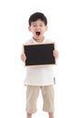 Cute asian boy holding chalkboard on white background Royalty Free Stock Photo